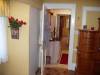 Looking from the master bedroom into the bathroom, hall,
       and dining room.