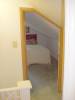 The door of the second bedroom above the stairs.